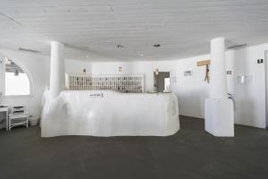 Un pat sau paturi într-o cameră la Mari del Sud Resort