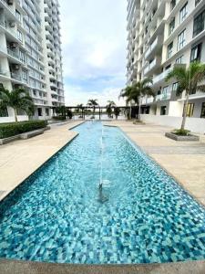 a large pool of water in front of some buildings at 1105 Modern Comfort Next to Paradigm 4pax 2bedroom JB in Johor Bahru