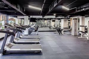 a gym with rows of treadmills and machines at Radisson Bogota Metrotel in Bogotá +191 photos