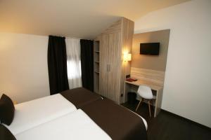 Voodi või voodid majutusasutuse Hotel Pyrénées toas