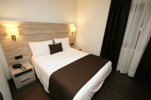 Voodi või voodid majutusasutuse Hotel Pyrénées toas