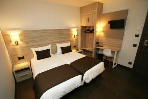 Voodi või voodid majutusasutuse Hotel Pyrénées toas