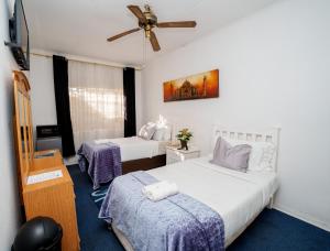 Katil atau katil-katil dalam bilik di Terrys Cozy Homestay +24 gambar