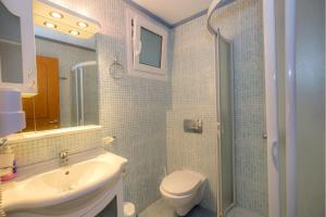 a bathroom with a sink and a toilet and a shower at Balkan House in Potos +35 photos