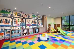 Luwansa Hotel and Convention Center Manado客房内的一张或多张床位