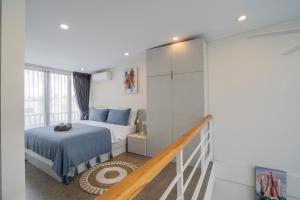 En eller flere senge i et værelse på Wolu Loft 28 - 1BR North Canggu
