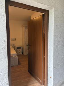 an open door to a room with a bed at El bait agritur Paolazzi in Sover +1 photo