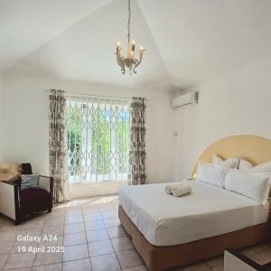 Postel nebo postele na pokoji v ubytování The Coral House