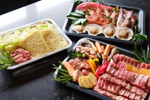 three trays of different types of food on a table at Little Deer by SANA in Tateyama