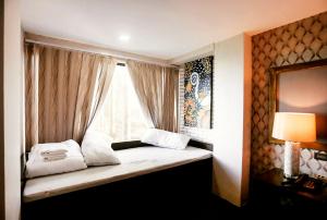 Postel nebo postele na pokoji v ubytování Amega Hotel Tagaytay