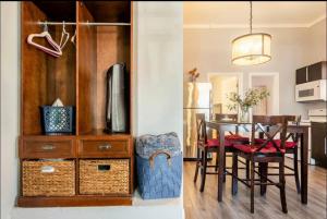 a kitchen and dining room with a table and chairs at Free Parking Cozy 1BR in Gaslamp Conv Center in San Diego