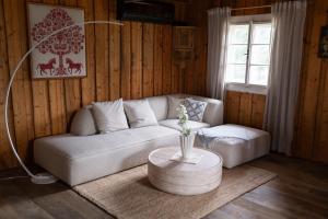 a living room with a couch and a table at Landhaus Danner in Goldwörth