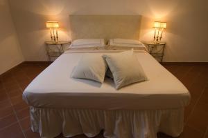 Postel nebo postele na pokoji v ubytování Michelangelo Escape Suite + 29 fotografií