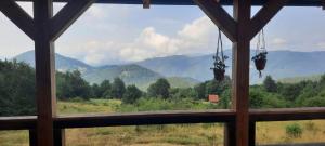 a view from a window of a mountain view at Odmori se in Mokra Gora
