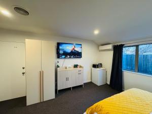 Giường trong phòng chung tại Comfort Stay Christchurch