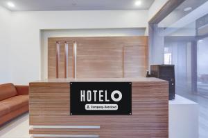 a hotel sign on a counter in a room at Hotel O Haldwani Near Bus Stand Formerly City Square in Haldwāni