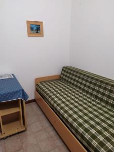 a bedroom with a bed and a table at GallyBi in Gallipoli