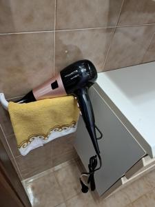 a hairdryer is on the edge of a counter at GallyBi in Gallipoli
