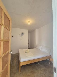 Postel nebo postele na pokoji v ubytování Camotes Hostel Resort