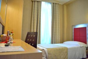Postel nebo postele na pokoji v ubytování Hotel Susa