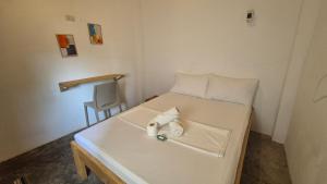 Postel nebo postele na pokoji v ubytování Camotes Hostel Resort