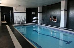 a large swimming pool in a hotel room at Best Western Plus Hotel Alfa Aeropuerto in Barcelona