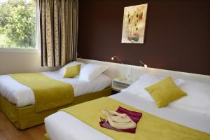 Postel nebo postele na pokoji v ubytování Hotel Le Lagon