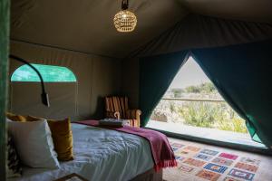 Ένα ή περισσότερα κρεβάτια σε δωμάτιο στο Okamanja Lodge