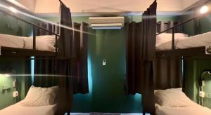 Llit o llits en una habitació de Nimman Forest Hostel
