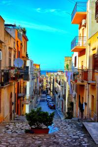 a view of a city street with buildings at Flamingo Room in Castellammare del Golfo