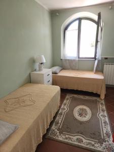 Ένα ή περισσότερα κρεβάτια σε δωμάτιο στο Gioia Montedoro +20 φωτογραφίες