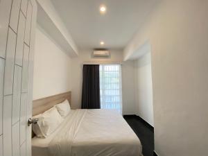 Ένα ή περισσότερα κρεβάτια σε δωμάτιο στο apartement nata umalas