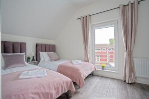 En eller flere senge i et værelse på Ošupio tako Lux Vilos with Free Parking