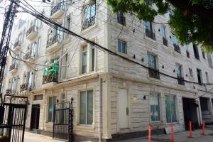 a building on the corner of a street at 116 Apartments Luxestay CBD in Lahore
