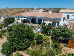 an aerial view of a house with trees at Casa Monte Salema in Vila do Bispo