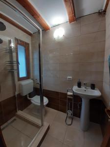 a bathroom with a toilet and a sink at Hanga Apartments in Sovata +33 photos