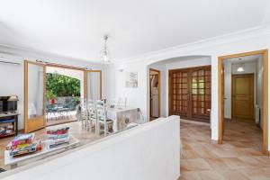 a living room with a table and a dining room at La Pascaline - 20min de Grasse in Le Bar-sur-Loup