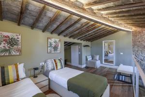 Katil atau katil-katil dalam bilik di Il Parione Luxury Apartment with view, Florence