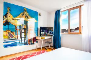 Ένα ή περισσότερα κρεβάτια σε δωμάτιο στο Spacious 3br In The Center - Kitchen Smart Tv's