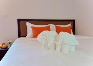 Ένα ή περισσότερα κρεβάτια σε δωμάτιο στο Tha Phae Village +195 φωτογραφίες