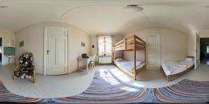 a room with two bunk beds and a rug at Medstugans Pilgrimsboende in Medstugan