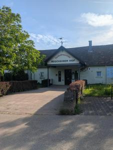 a white building with a sign that reads reproductive hog at Ferienhaus Thomm in Konz +8 photos