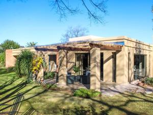 a small house with a garden in front of it at Cozy Corner in Bloemfontein