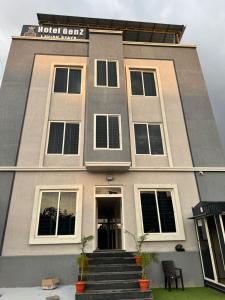 a building with stairs in front of it at Sri Laveeza Hotels in Hyderabad