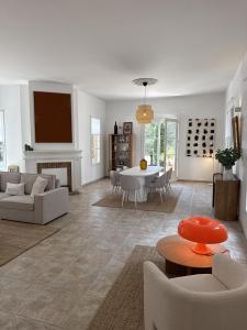 a living room with a couch and a table at Panorama by maison bacou in Carcassonne