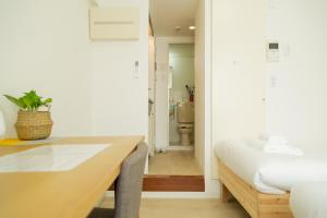 Ένα ή περισσότερα κρεβάτια σε δωμάτιο στο Ikebukuro 301 Twin Room