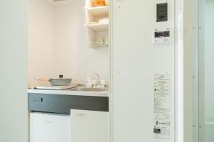 Η κουζίνα ή μικρή κουζίνα στο Ikebukuro 301 Twin Room