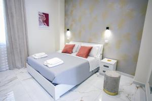 Ένα ή περισσότερα κρεβάτια σε δωμάτιο στο Lilì Apartments +35 φωτογραφίες