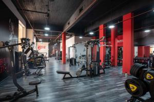 a gym with lots of equipment in a room at Ancient Sands Golf Resort and Residences in Hurghada