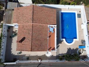 an overhead view of a building with a swimming pool at Villa Morar in Benalmádena